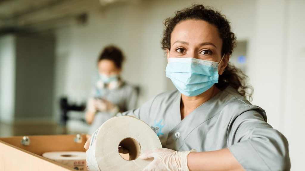 Woman at work providing free menstrual products
